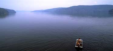 photo of guntersville reservoir with fishing boat